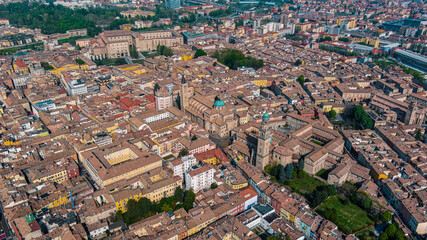 Aerial view of Parma is a university city in Italy's Emilia-Romagna region. Romanesque buildings, inc. the frescoed Parma Cathedral with the pink marble Baptistery in city center from above 5.5K UHD - obrazy, fototapety, plakaty
