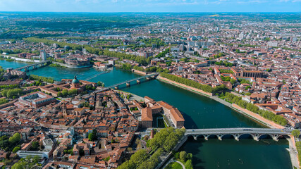 Toulouse city and Garonne river aerial panoramic view. It's the capital of southern France Occitanie region. Historical landmark Dome de La Grave from above in Haute Garonne on a summer day 5.5K UHD - obrazy, fototapety, plakaty