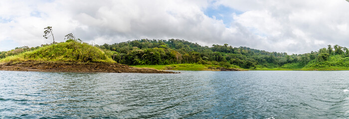A view across a cove on the shoreline of the Arenal Lake in Costa Rica during the dry season