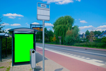 empty billboard with chroma key at european bus stop, advertisement concept