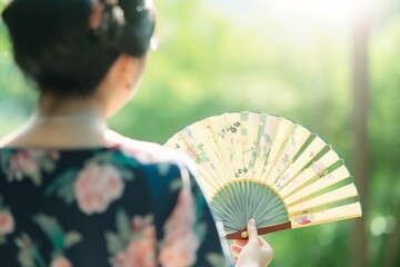 A portrait of woman holding a fan