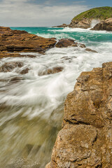 Bucolic landscape with beach on a cloudy day in the touristic city of Armação dos Buzios, coastline of Rio de Janeiro, Brazil.