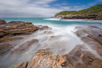 Bucolic landscape with beach on a cloudy day in the touristic city of Armação dos Buzios, coastline of Rio de Janeiro, Brazil.