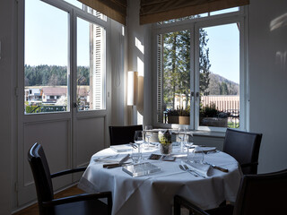 Cozy restaurant interior. Space filled with the morning sun.