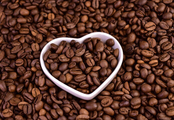 Coffee beans and a plate in the shape of a heart.Coffee beans in the shape of a heart.
