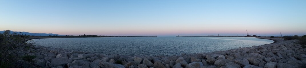 Sunrise over the sea with lighthouses