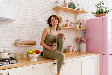 healthy slim woman in kitchen in the morning, diet food wellness