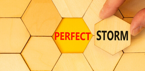 Perfect storm symbol. Concept words Perfect storm typed on wooden puzzles. Beautiful yellow table...