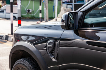 Pickup truck front fender with ventilation grille and turbo lettering