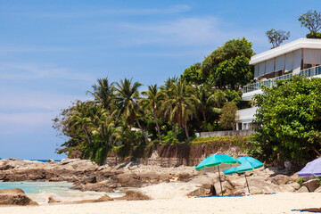 beautiful bright nai harn beach in thailand on phuket island with clear turquoise water in the sea, white sand and blue sky. A popular tourist place in the hot countries of Asia.