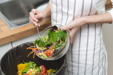 Food waste environment concept, people throwing food garbage into bin prepare to decompose.