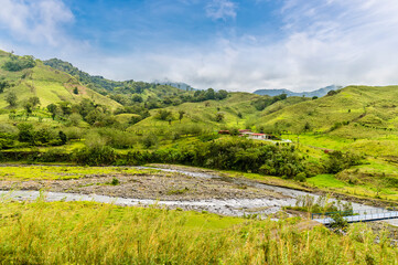 Fototapeta na wymiar A view towards a tributary feeding into the Arenal Lake in Costa Rica during the dry season