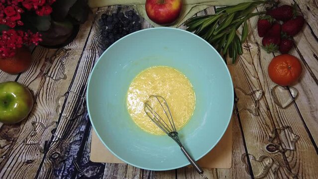 Making omlet or cake preparation. Overhead shot, cooking, food prep. High quality 4k footage