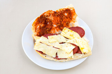 Turkish karisik atom Ayvalik tost ( kasarli bazlama tost) . Sucuklu, Kasarli, kavurmali karisik tost. Flat baked bread toasted