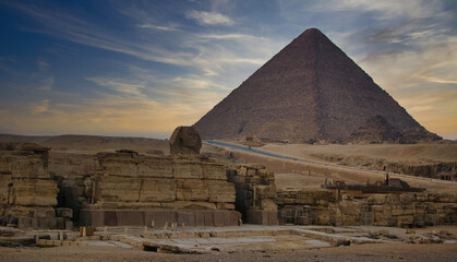 Fototapeta na wymiar Giza Cheops Pyramid and Sphinx at sunset without tourists