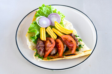 Meatball between bread (Turkish name : ekmek arasi kofte ). Izgara kofte