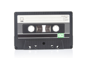 Old vintage audio cassette close up isolated on white background
