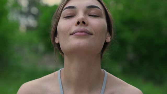 Relaxed woman breathing fresh air outdoors