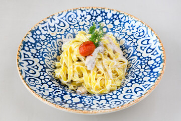 Macaroni Salad with red bell pepper, onion, celery, gherkins and mayonnaise dressing.Traditional Italian pasta with vegetables and creamy cottage cheese in a bowl. Fettuccini, alfredo makarna. 