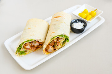 Lavash doner kebab ( zurna doner durum )  or shawarma sliced in plate isolated. 