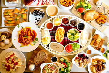 Table scene of assorted take out or delivery foods. Traditional Turkish cuisine. Various Turkish meal and appetizers. Top down view on a table.