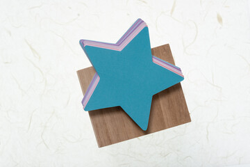 stars on a wooden object and paper background