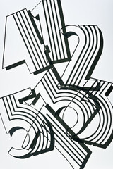 fancy type machine cut paper numbers on a light surface - 412, 536, and 7 