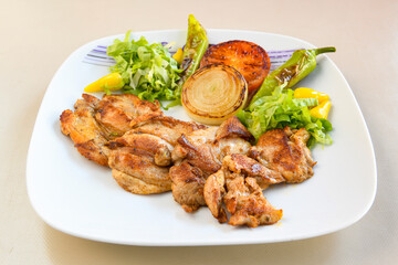 Turkish and Arabic Traditional Ramadan doner kebab with tasty tomato sauce and rice or turkish pilav in white plate on wood table background. ( Pilav ustu doner)