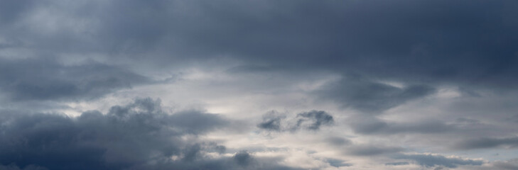 Obraz premium Ominous sky with dark clouds. Dark storm clouds covered the sky