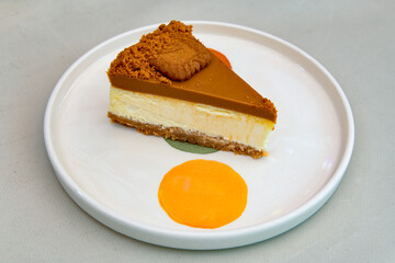 San sebastian ( Bask ) cheesecake slice isolated close up. Limon, lotus, fistikli, Frambuazli cheesecake