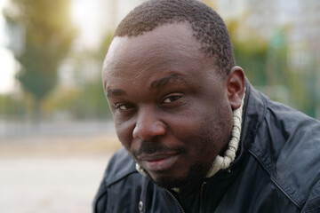 African american man from Nigeria looks at camera