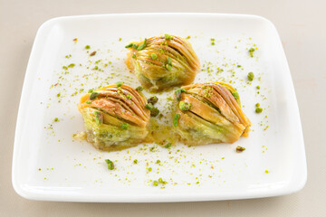 Turkish Dessert Sobiyet Baklava, mussels baklava and classic baklava with Pistachio . Didye, Cevizli, Fistikli Baklava, top view.