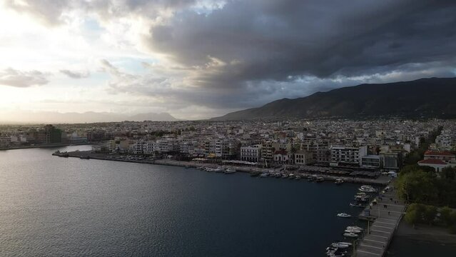Aerial iconic sunset view over the port of Kalamata seaside city, Greece