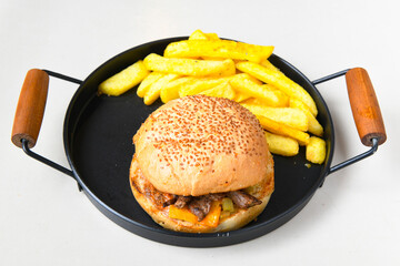 Big tasty burger with beef cutlet on a plate