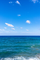 Mediterranean sea horizon line in bright blue sky background.
