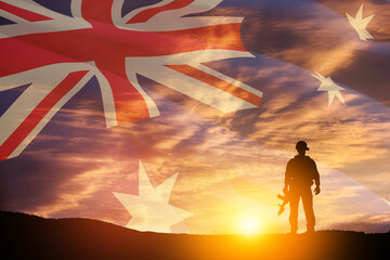 Silhouette of soldier on background of Australia flag and the sunset or the sunrise background. Anzac Day. Remembrance Day.