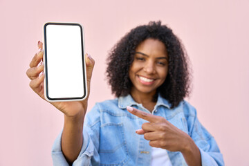 Happy smiling african american young woman showing mobile phone blank white screen mockup to camera...