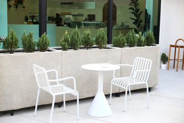 minimalist style sitting in the cafe shop with white and brown tone