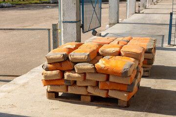 Cement bags are placed on pallets and stored in warehouses.