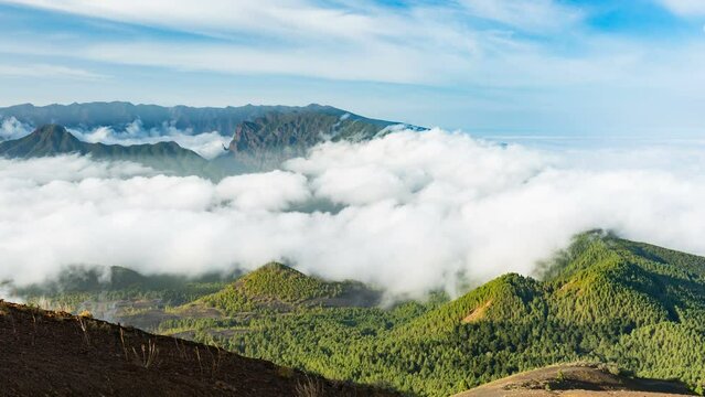 Timelapse sequence of tradewind clouds moving against the mountains of La Palma between the Caldera de Taburiente in the background and the Cumbre Vieja. Seen from the top of the volcano Birigoyo in t