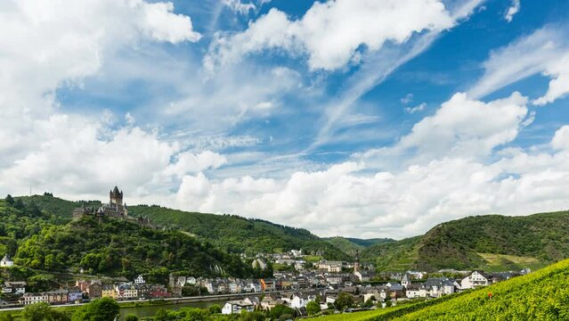 Summer vineyards timelapse at Moselle Valley with Cochem, Eifel in Germany in the background and the Reichsburg Cochem to the left.
