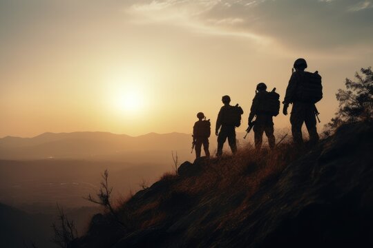 Silhouettes of soldiers on a mountain.