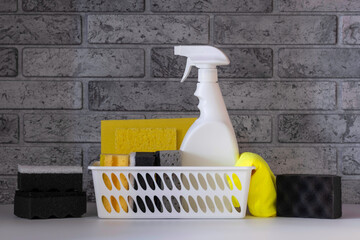 Basket with different cleaning products and washtools