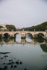 Fototapeta na wymiar Looking out at the View of the Tiber river in Rome, Italy on an overcast day