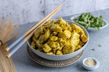 Chicken in curry sauce served in bowl