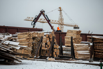 Fototapeta premium loading pallets with boards into freight wagons of a train