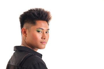 portrait of non binary asian person in profile in black shirt looking at camera on white background