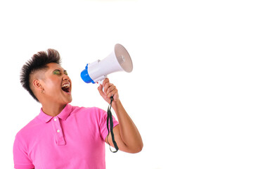 gender non binary asian person in pink shirt shouting into a megaphone on white background
