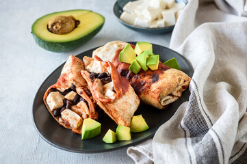 Enchiladas with chicken and avocado