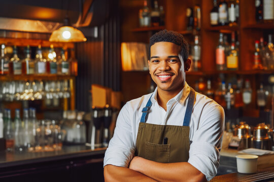 Bartender wearing apron and smiling. Confident young professional bartender friendly posing in front of bar. Generative AI.